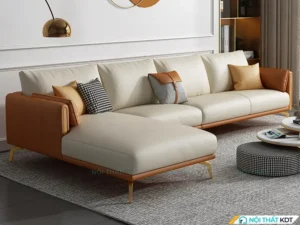 Một chiếc sofa sang trọng được đặt sát tường trong văn phòng hiện đại, phía trước là bàn trà và tầm