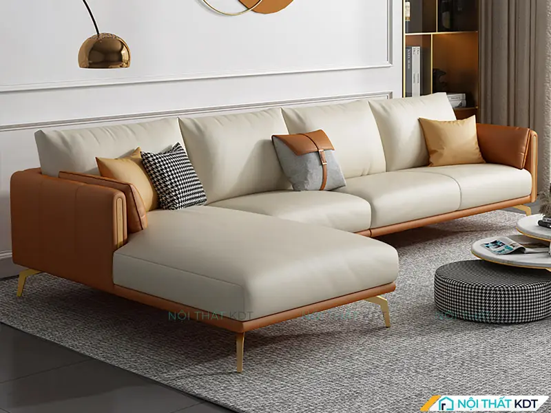 Một chiếc sofa sang trọng được đặt sát tường trong văn phòng hiện đại, phía trước là bàn trà và tầm