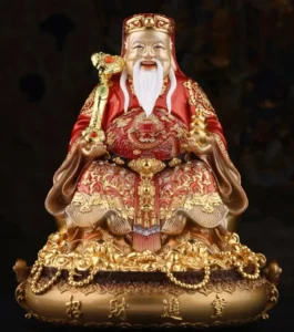 Ông Địa cười phúc hậu cầm quạt.